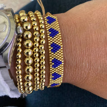 Load image into Gallery viewer, Neon woven bracelet with gold tiles